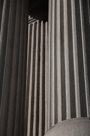 A black and white photo of a building with columns