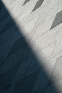 A person riding a skateboard down a sidewalk