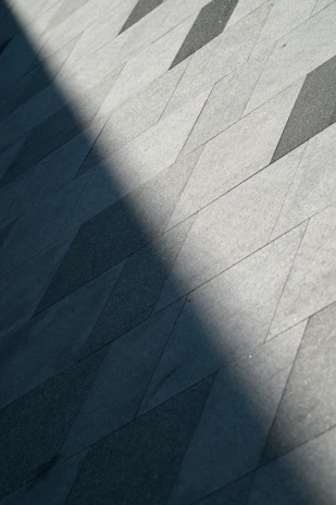 A person riding a skateboard down a sidewalk