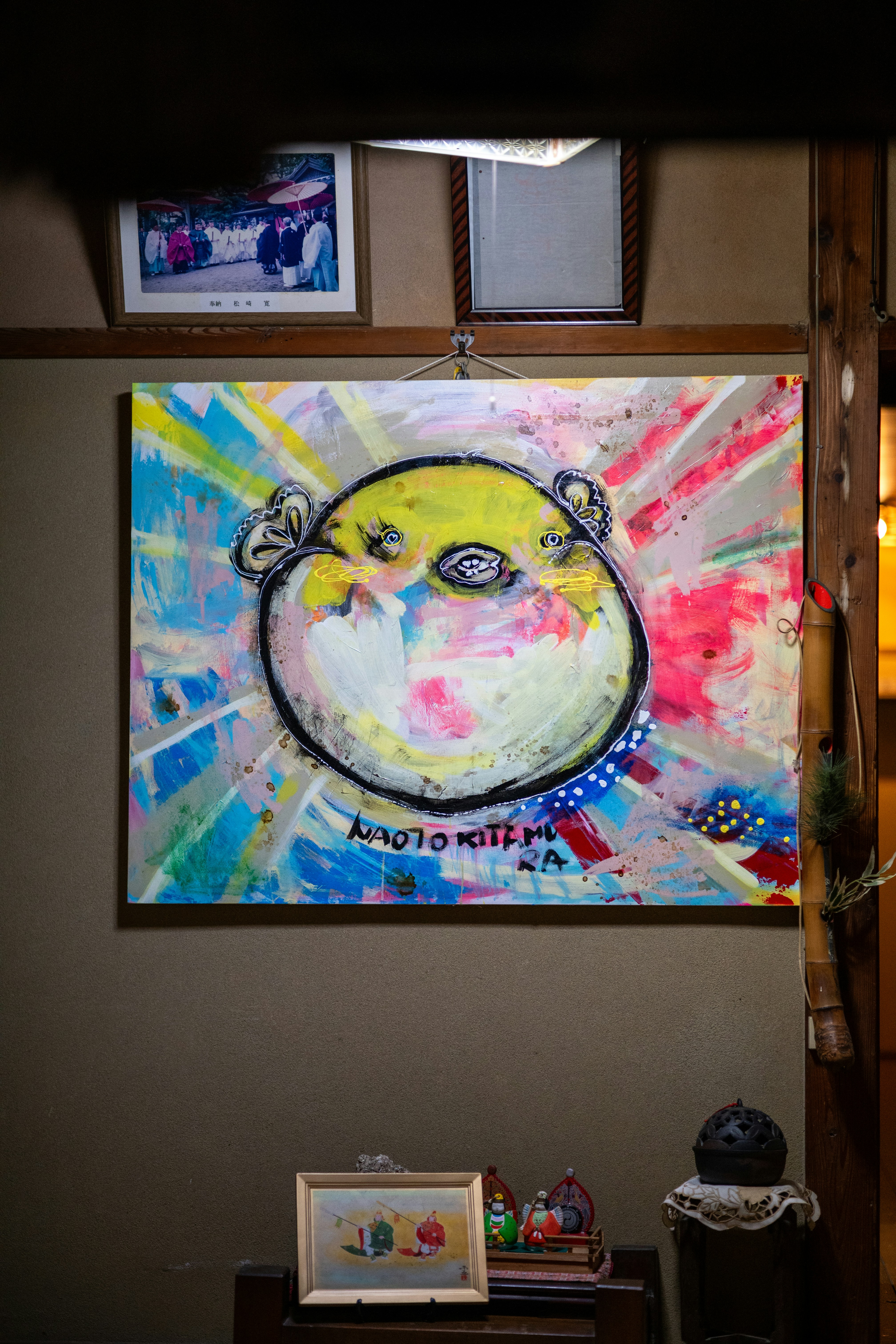 A painting hanging on the wall of a room