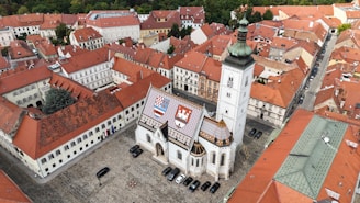 An aerial view of a city with red roofs