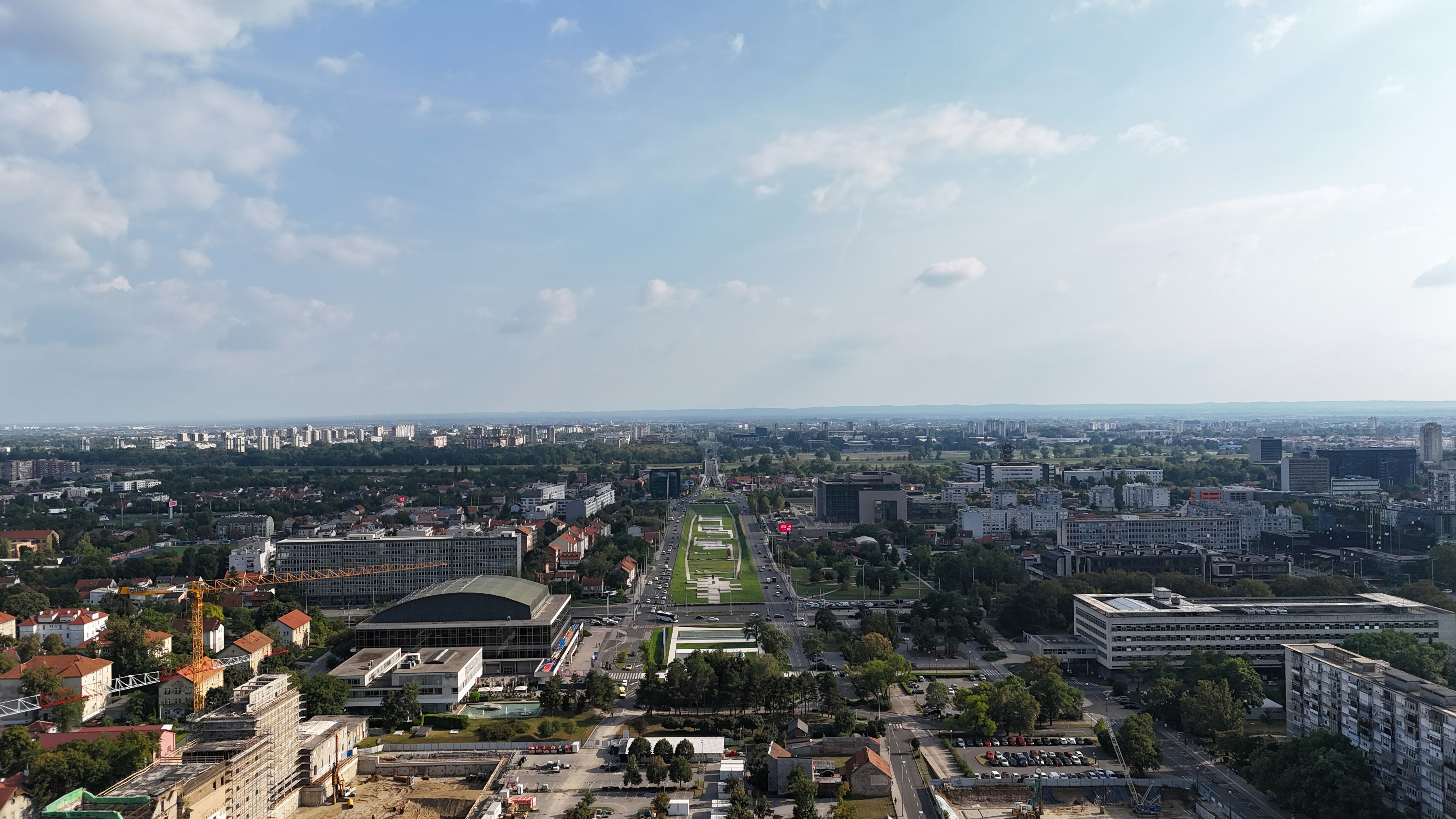 An aerial view of a city with tall buildings