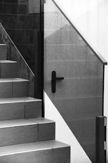 A black and white photo of a stair case
