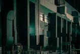 A room filled with lots of tall green and white appliances