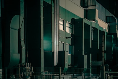A room filled with lots of tall green and white appliances