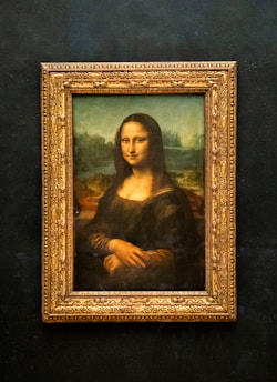 A painting of a woman in a gold frame