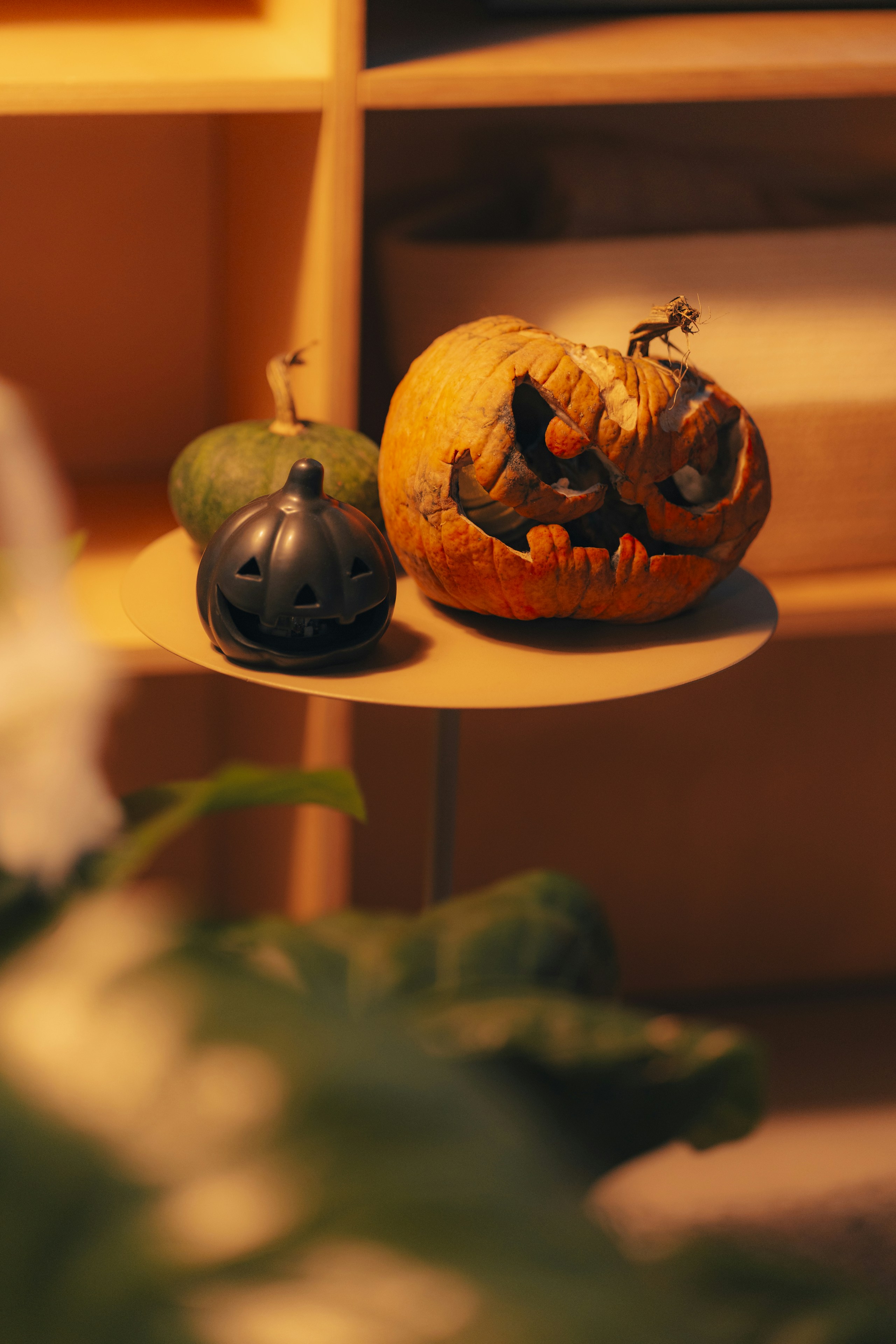 A couple of pumpkins sitting on top of a table