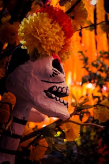A white mask with flowers on top of it