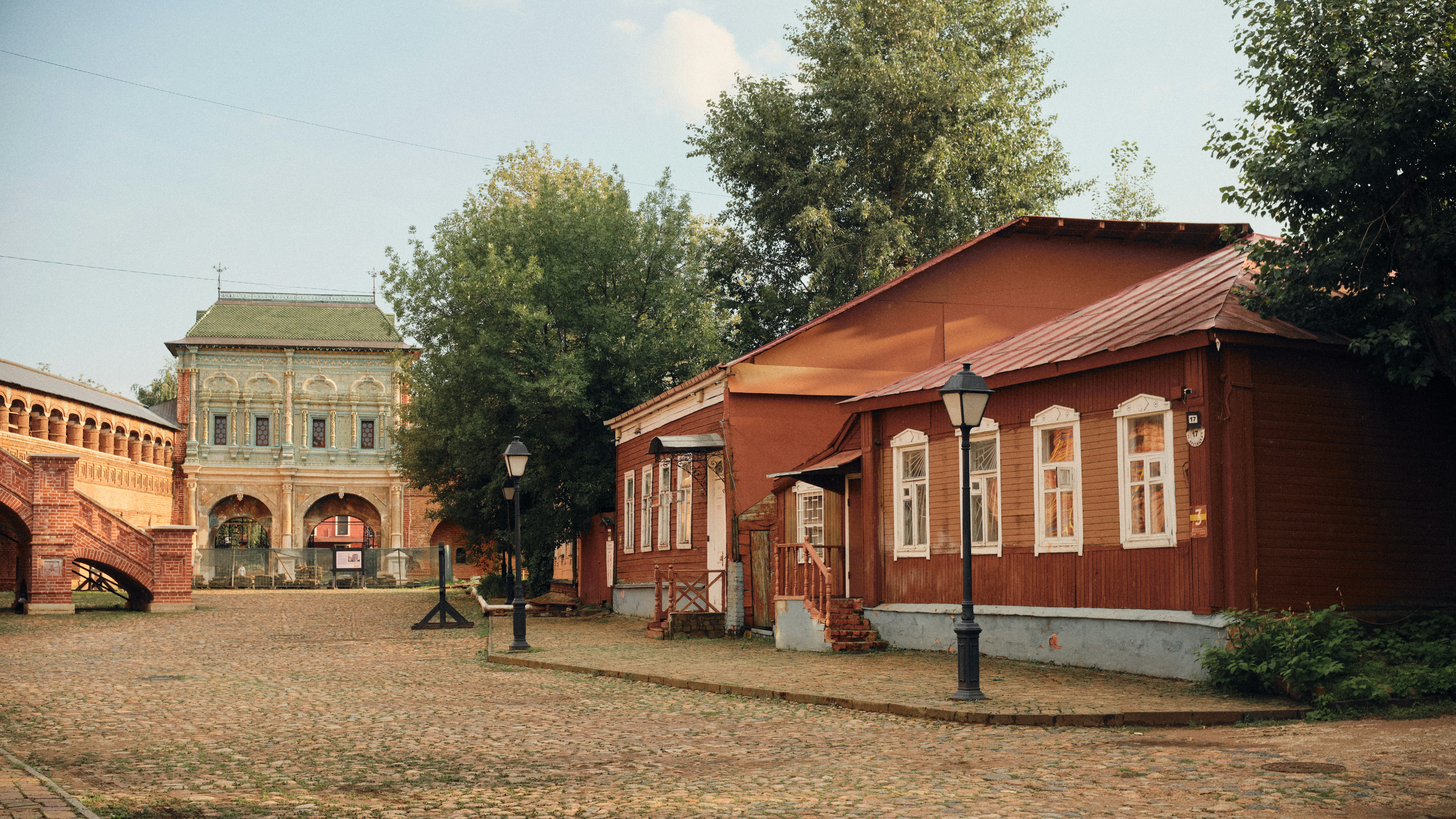 A red building with a bridge in the background