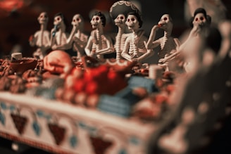 A group of figurines sitting on top of a table
