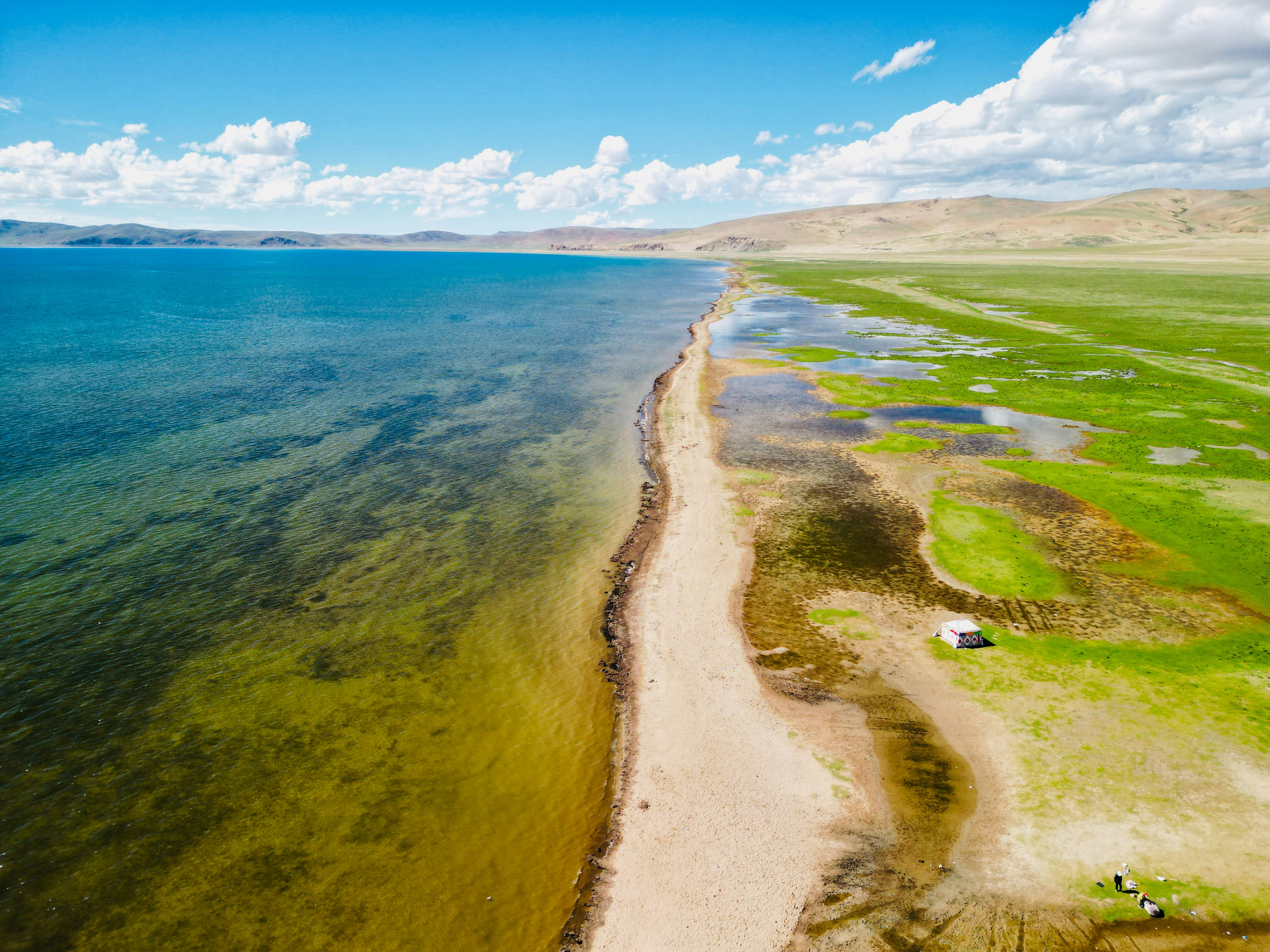 An aerial view of a beach and a body of water