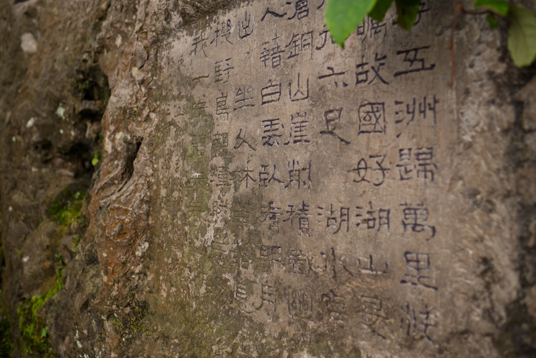 A close up of a rock with writing on it,
