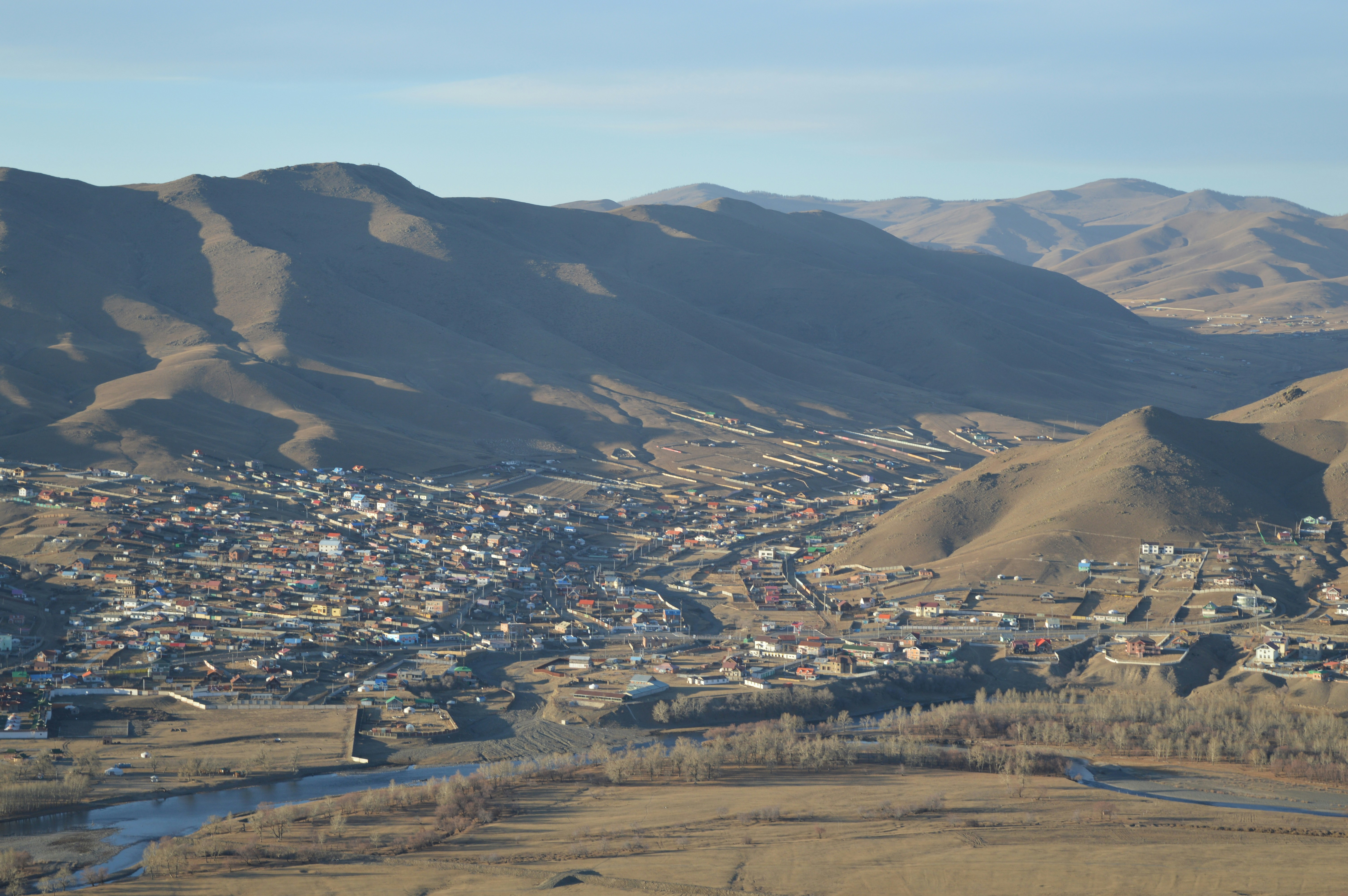 a view of a small town in the mountains
