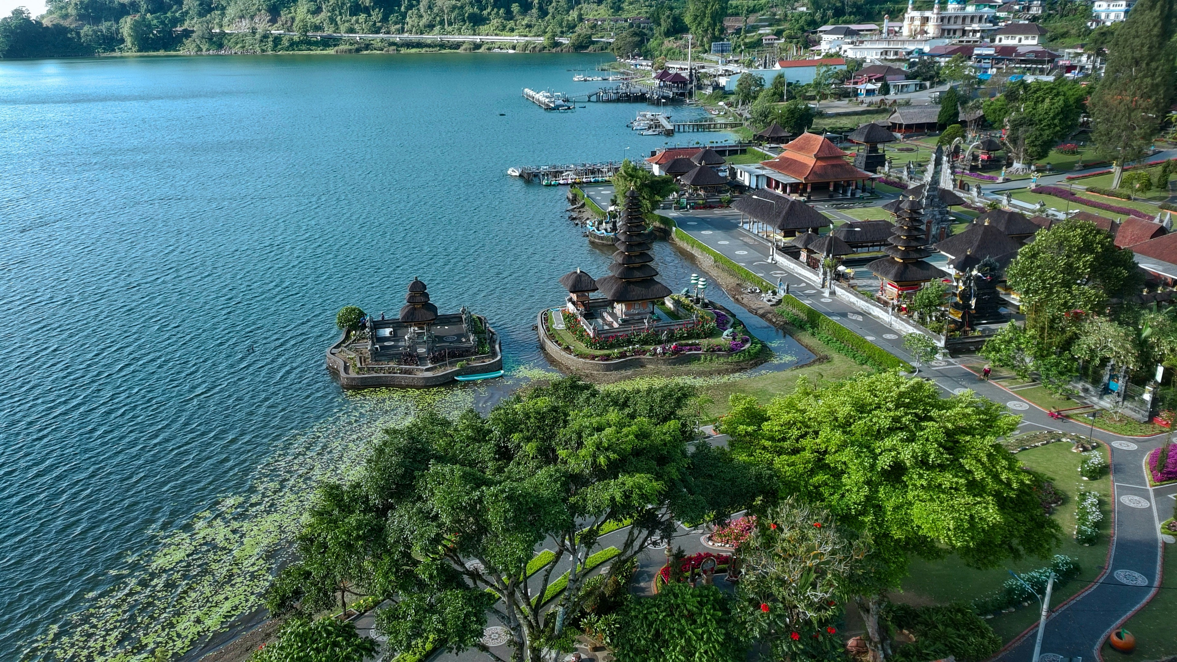 An aerial view of a town on a lake
