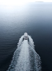 A boat traveling across a large body of water
