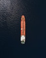 An aerial view of a cargo ship in the ocean