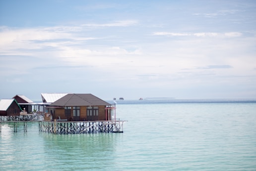 A house on stilts in the middle of the ocean