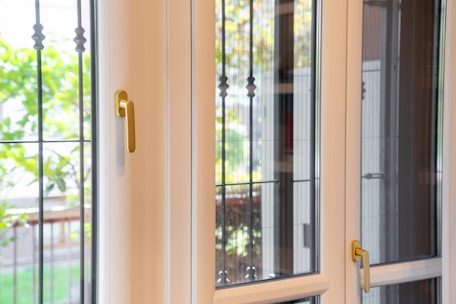 A window with a glass pane and a door handle