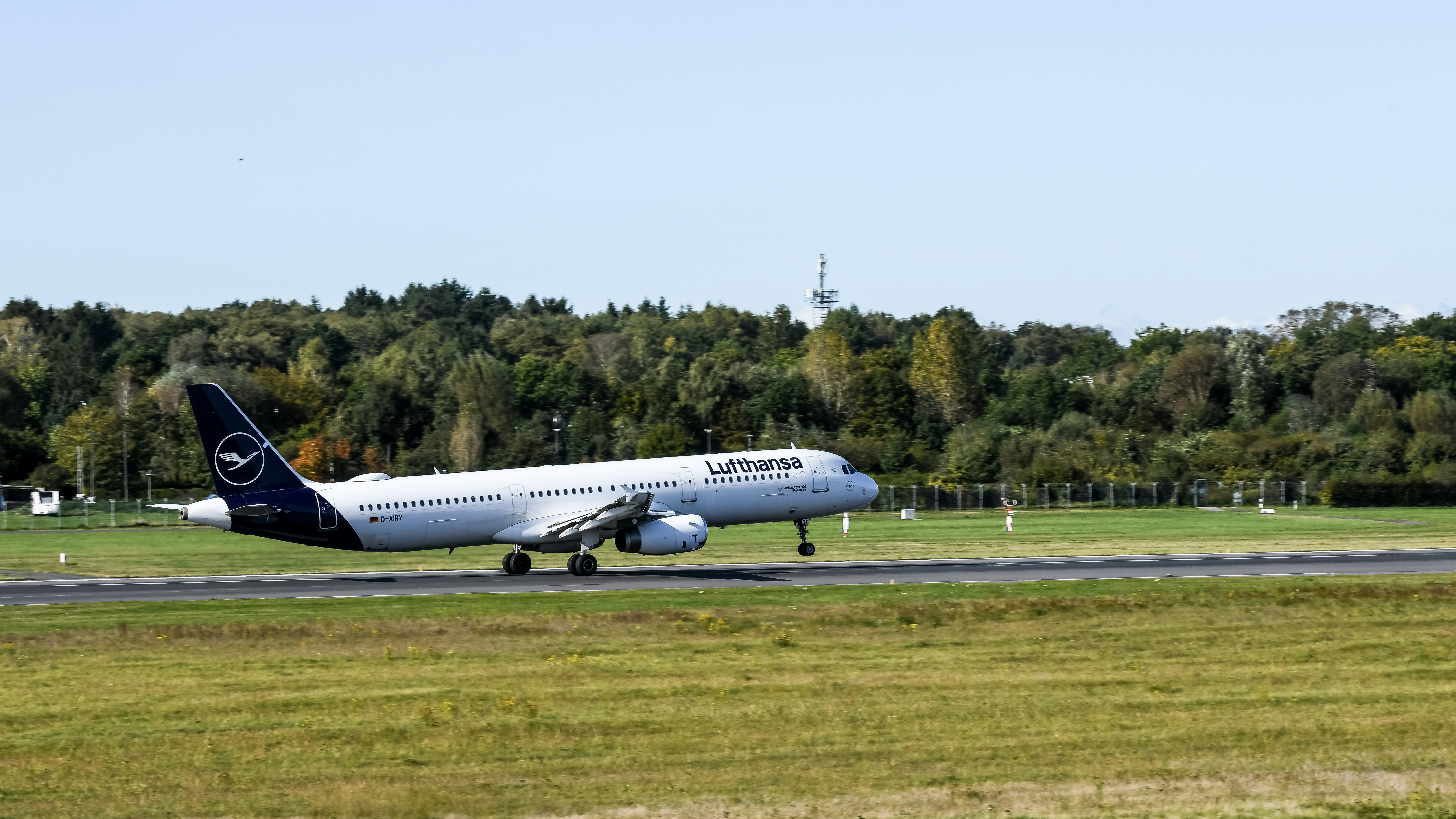 A large jetliner taking off from an airport runway