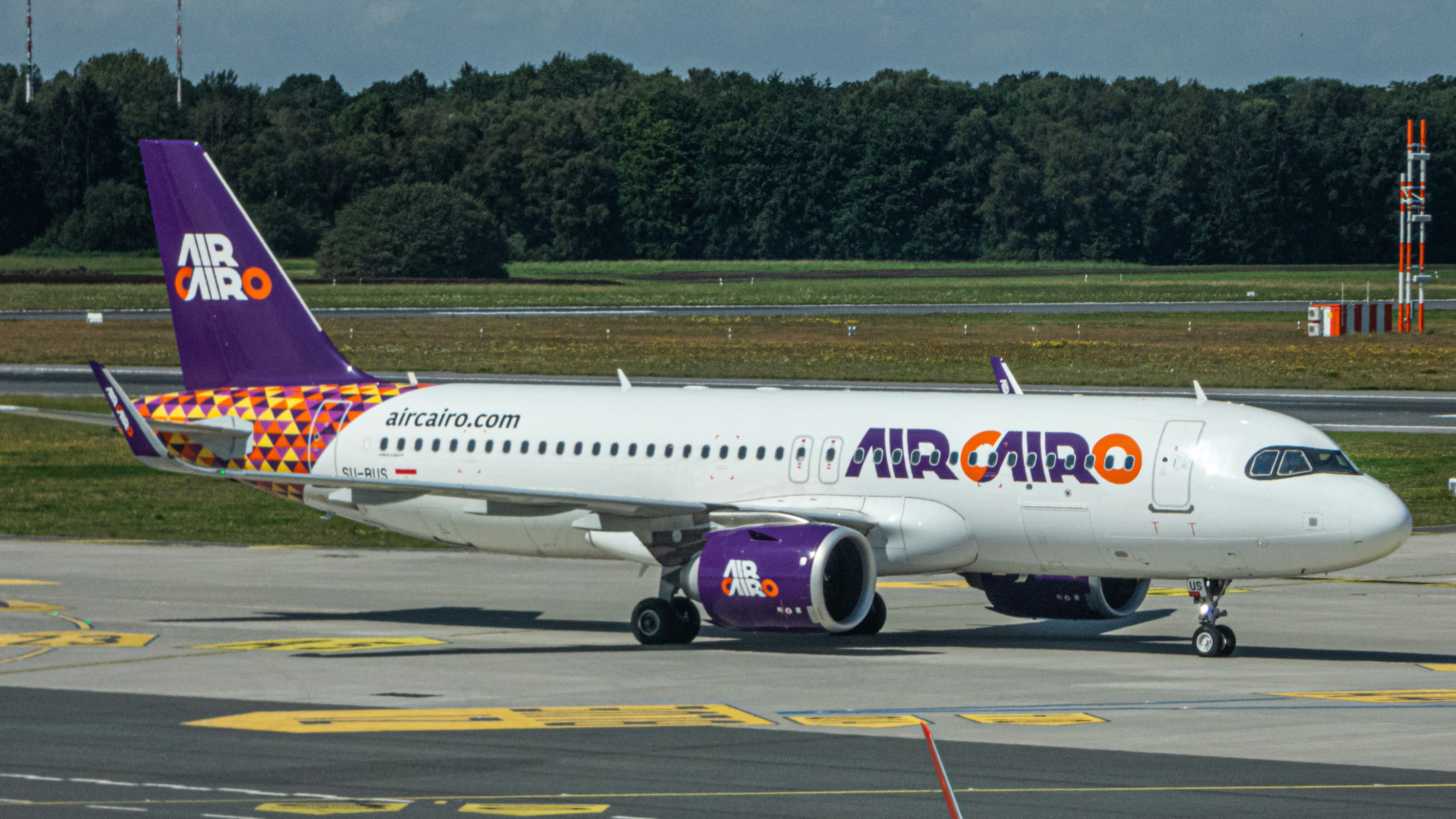 A large jetliner sitting on top of an airport runway