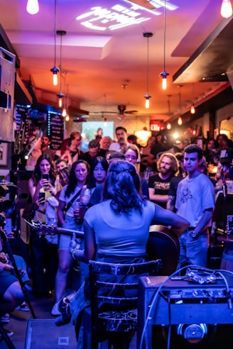 A group of people sitting around a bar