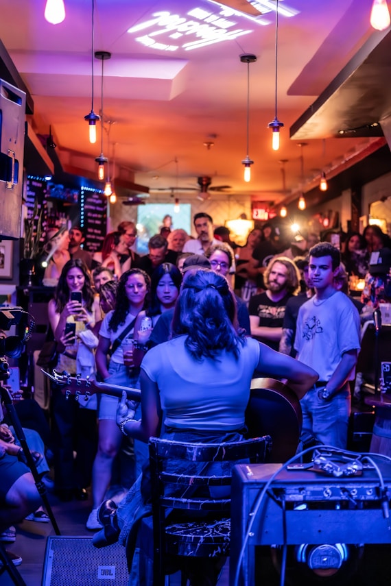 A group of people sitting around a bar
