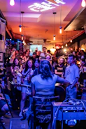 A group of people sitting around a bar