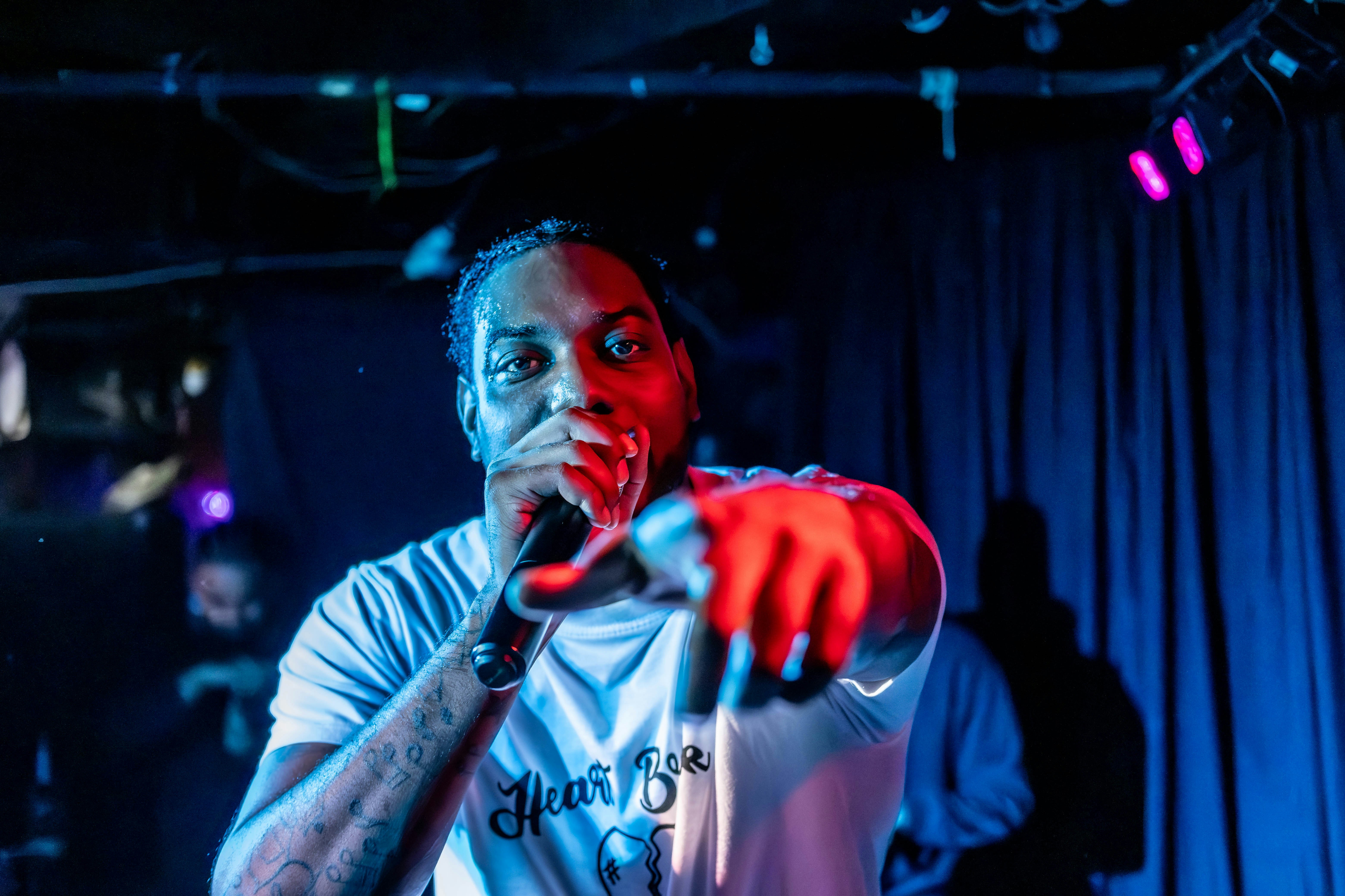 A man standing in front of a microphone