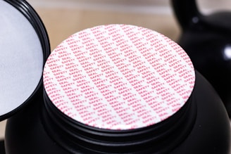 A close up of a container with a lid