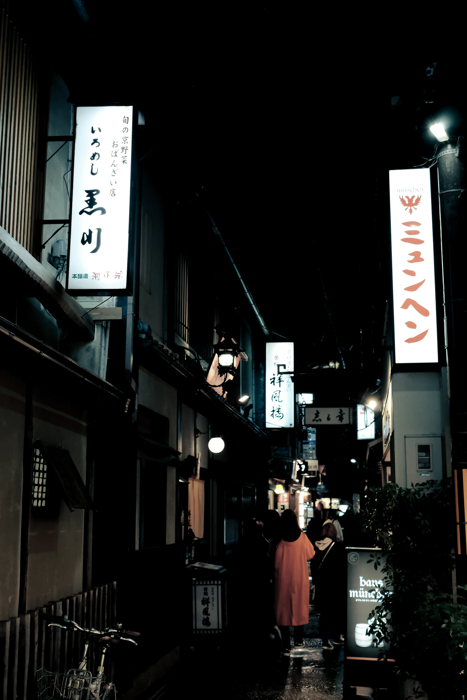 A quiet alley in Japan lit at night