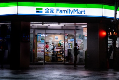 A family mart store lit up at night