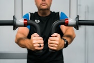 A man holding a pair of handles in his hands