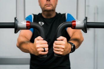 A man holding a pair of handles in his hands