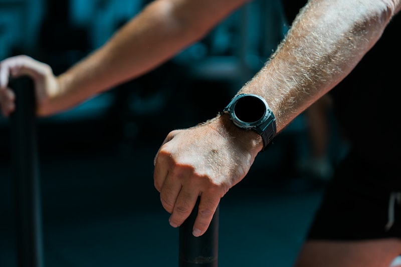 Senior wearing a fitness tracker watch on wrist for daily activity monitoring