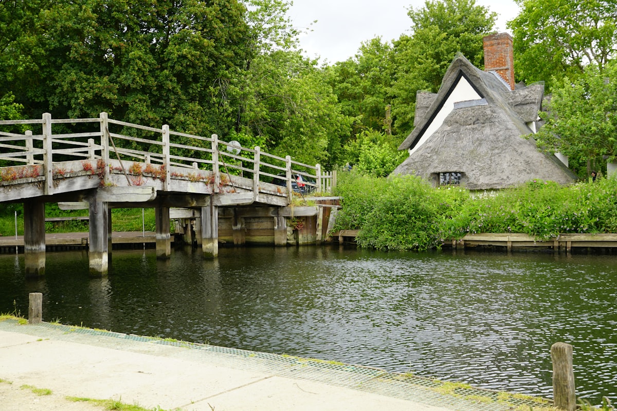 A wooden bridge over the River Stour in Constable Country, part of the Dedham Vale on the edge of Babergh, Suffolk