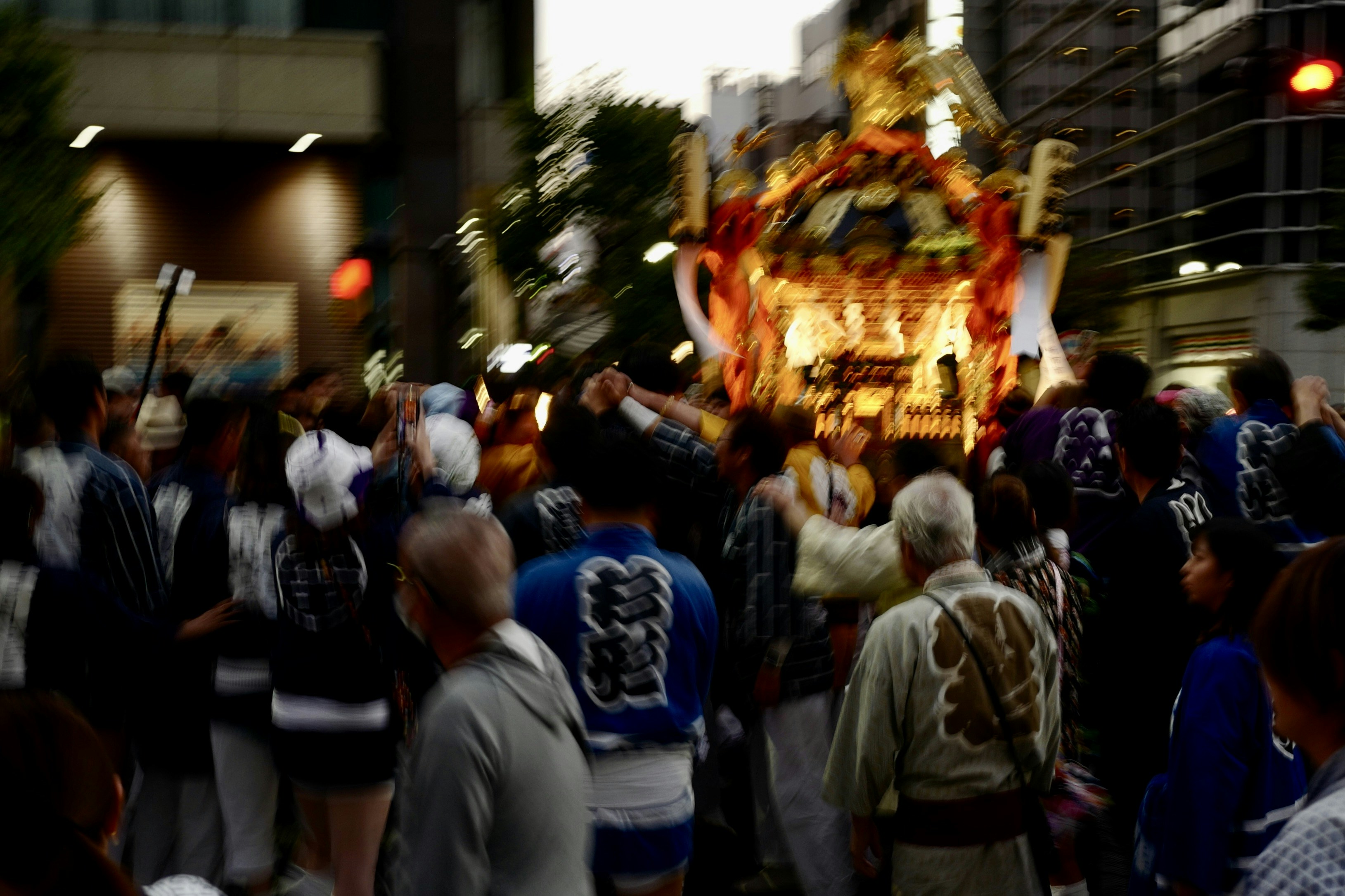 A crowd of people walking down a street