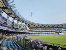 A cricket stadium filled with lots of people