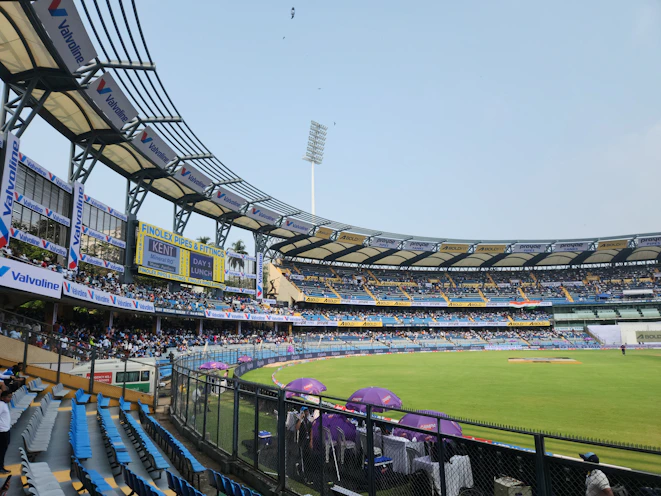 A cricket stadium filled with lots of people
