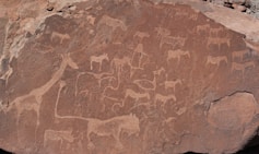 A large rock with a painting on it