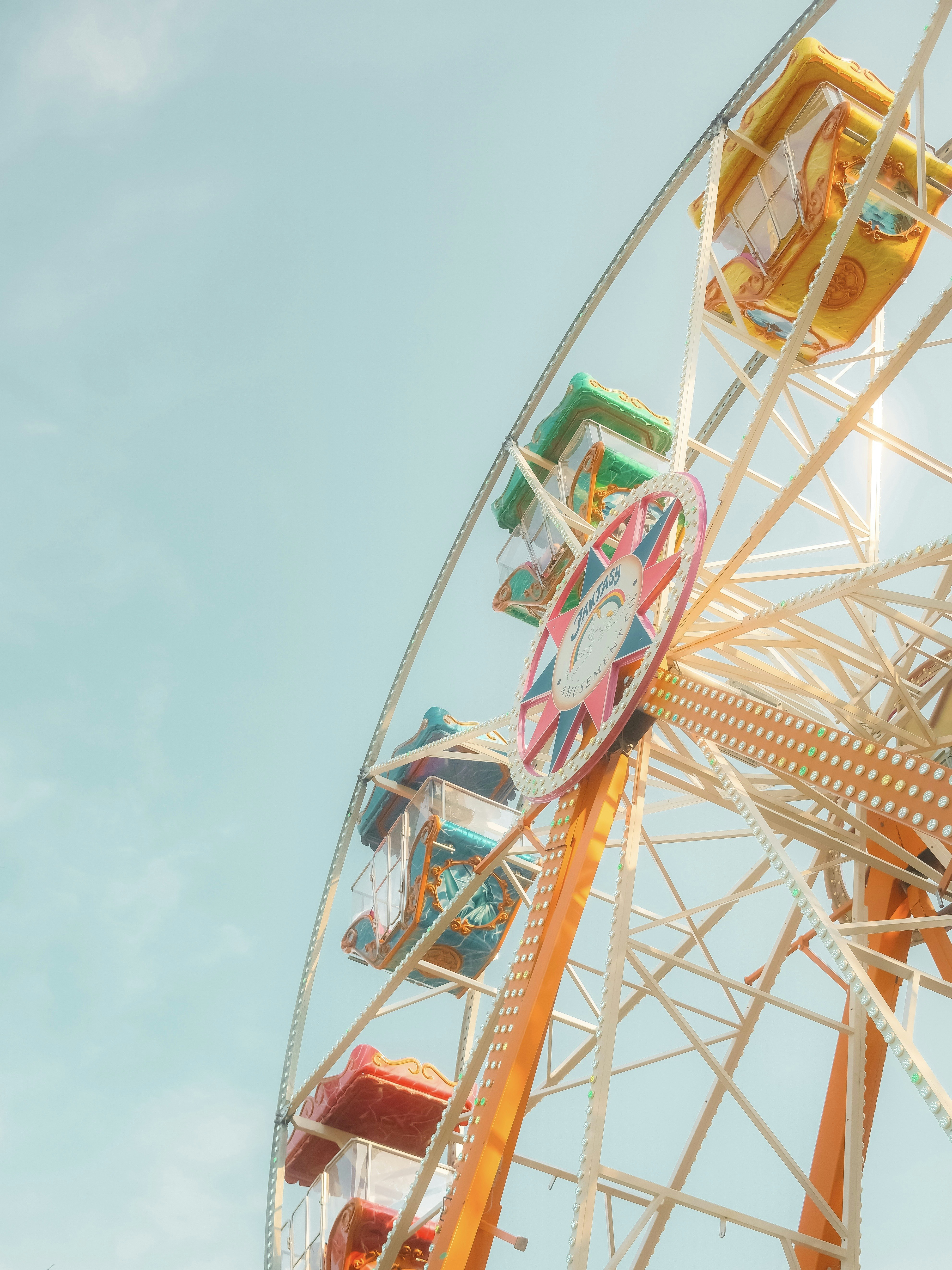 A ferris wheel with a sky background