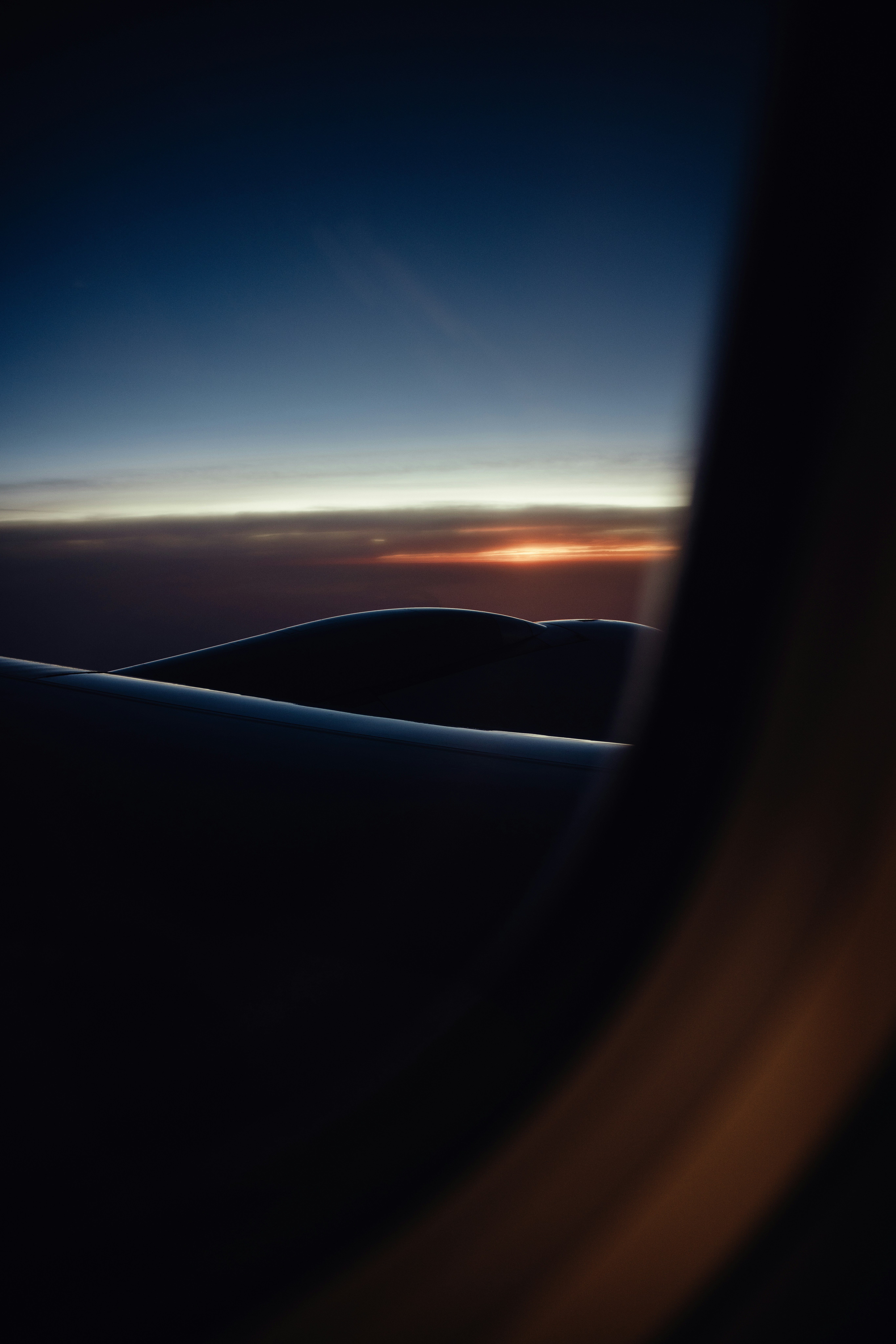 A view of a sunset from an airplane window