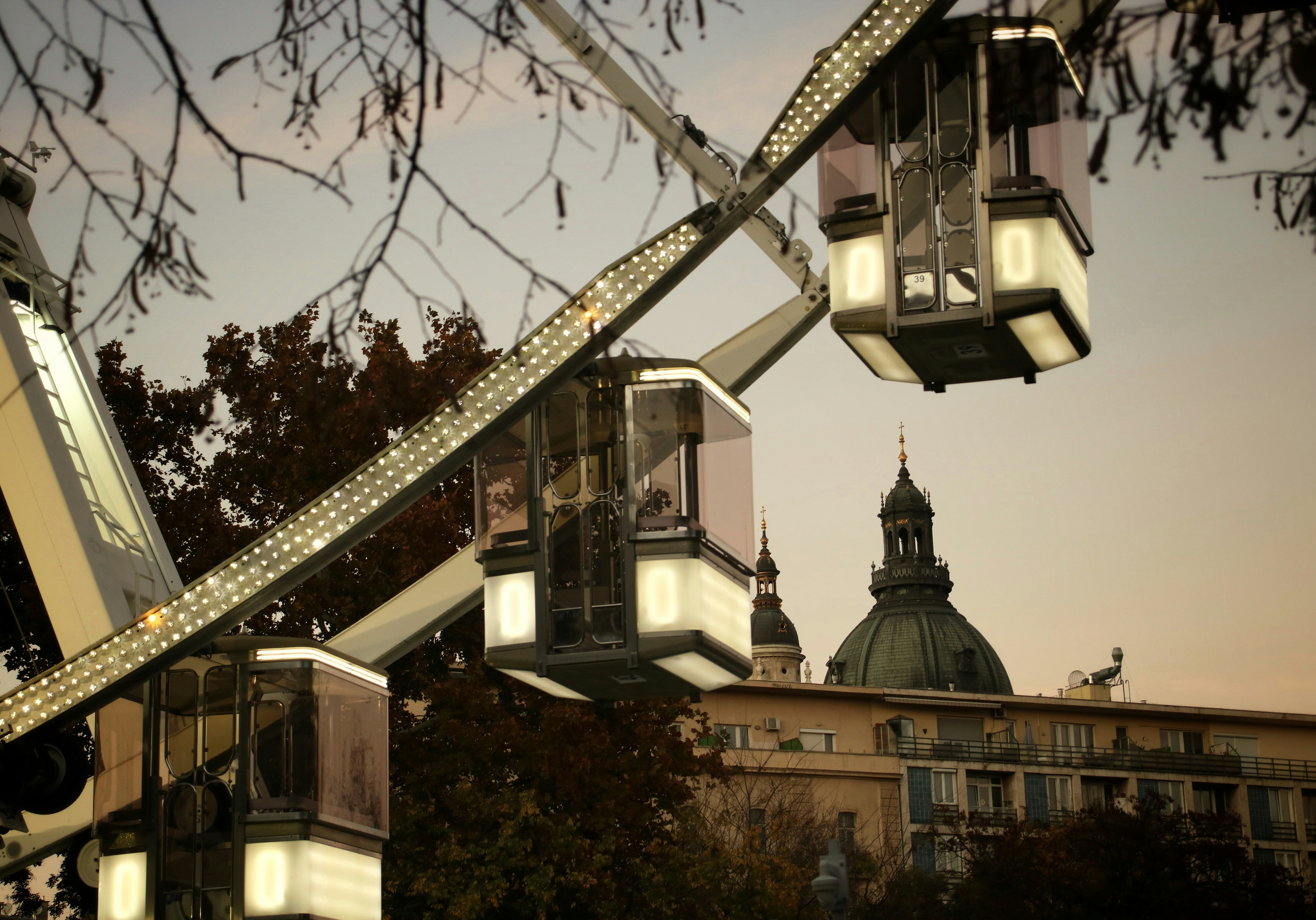 A ferris wheel with a building in the background