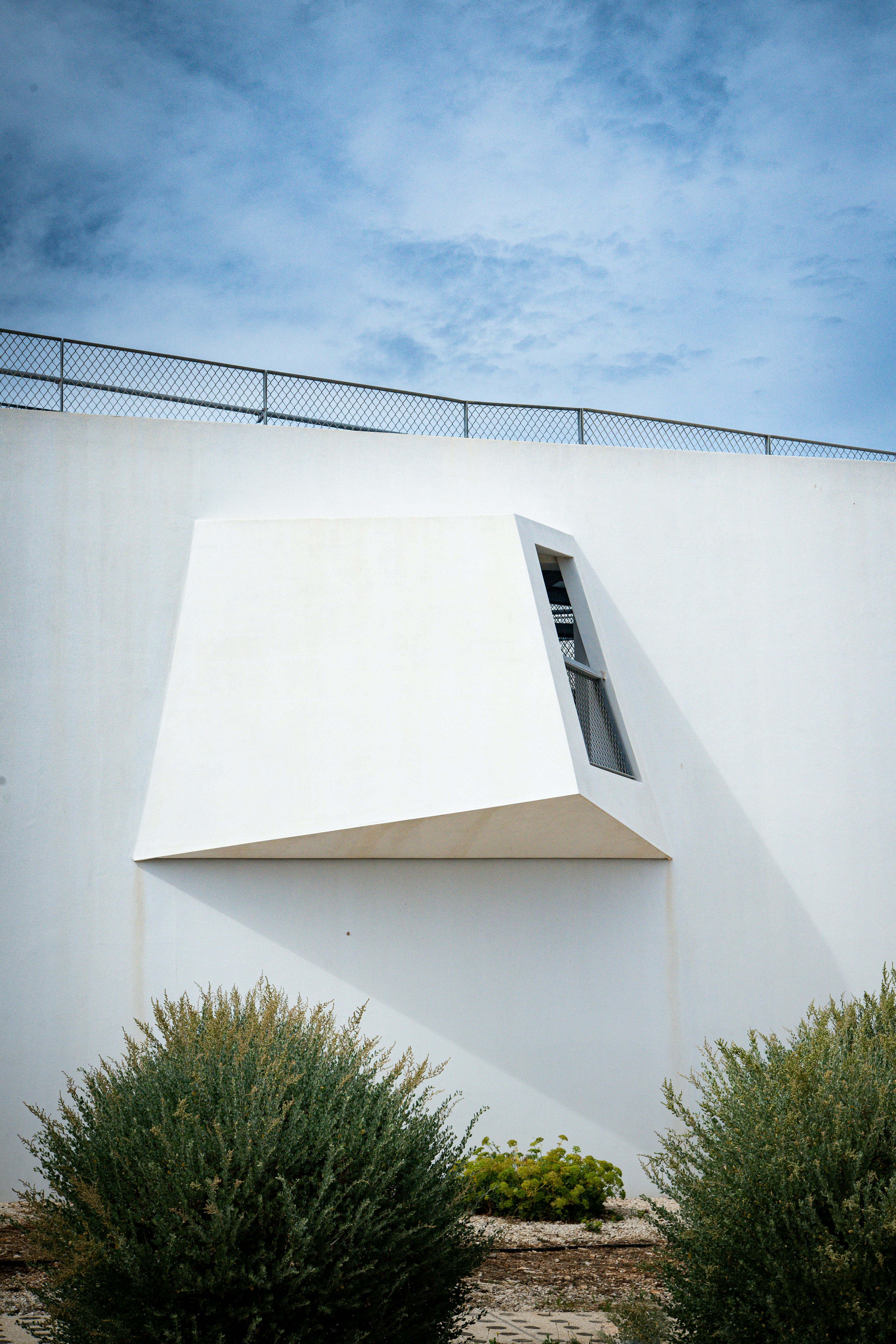 A white building with a sky background