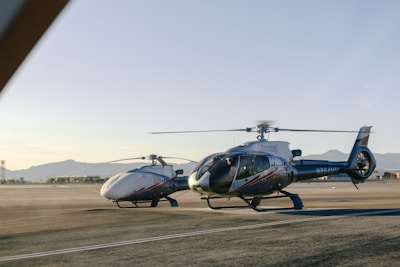 A helicopter sitting on top of an airport tarmac