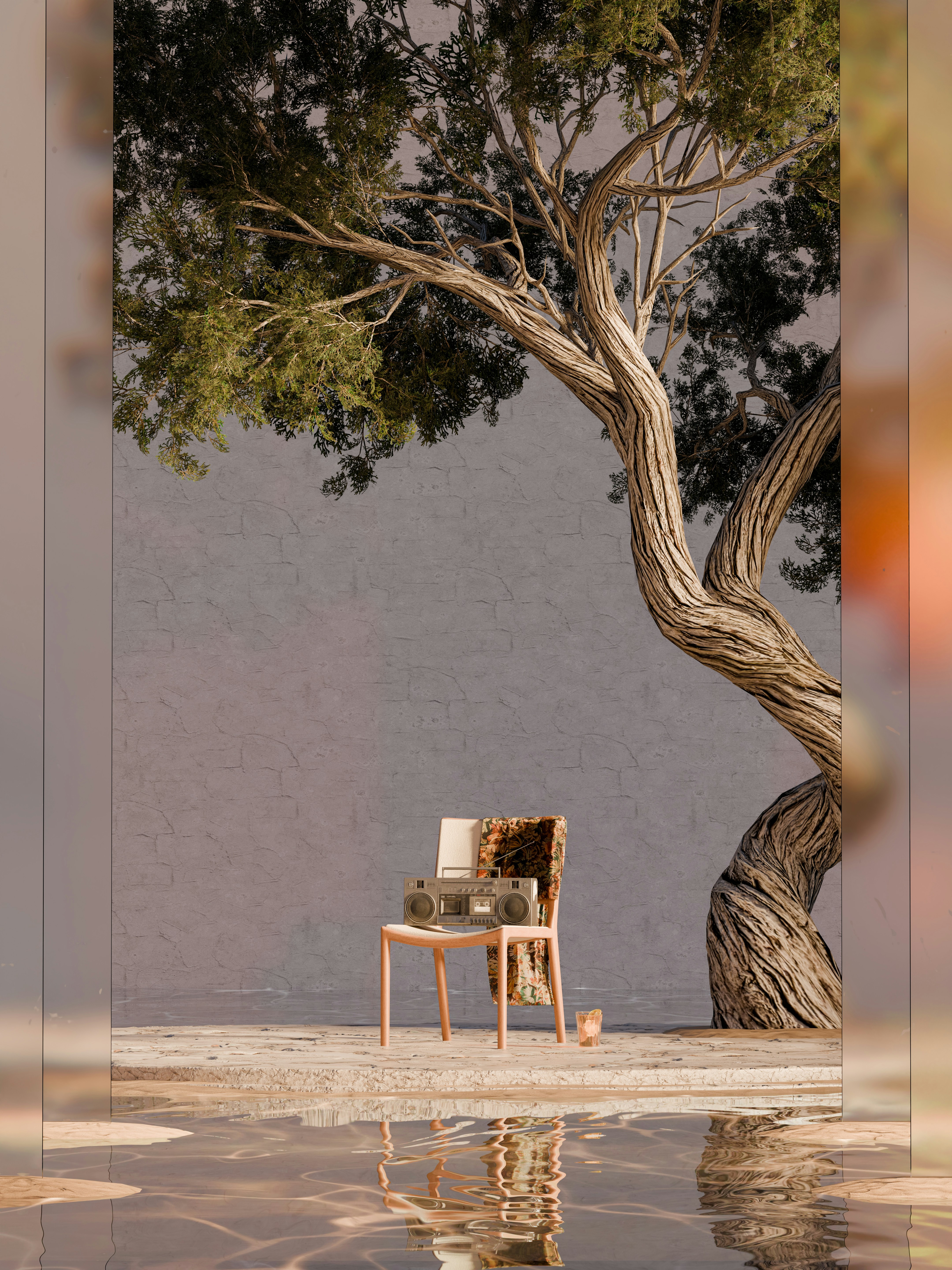 A chair sitting under a tree next to a body of water