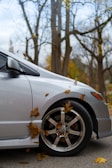 A silver car parked on the side of the road