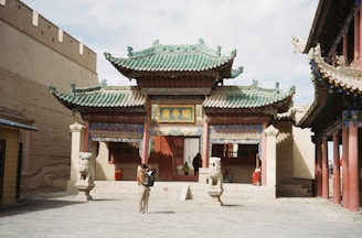 A person standing in front of a building
