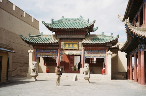 A person standing in front of a building
