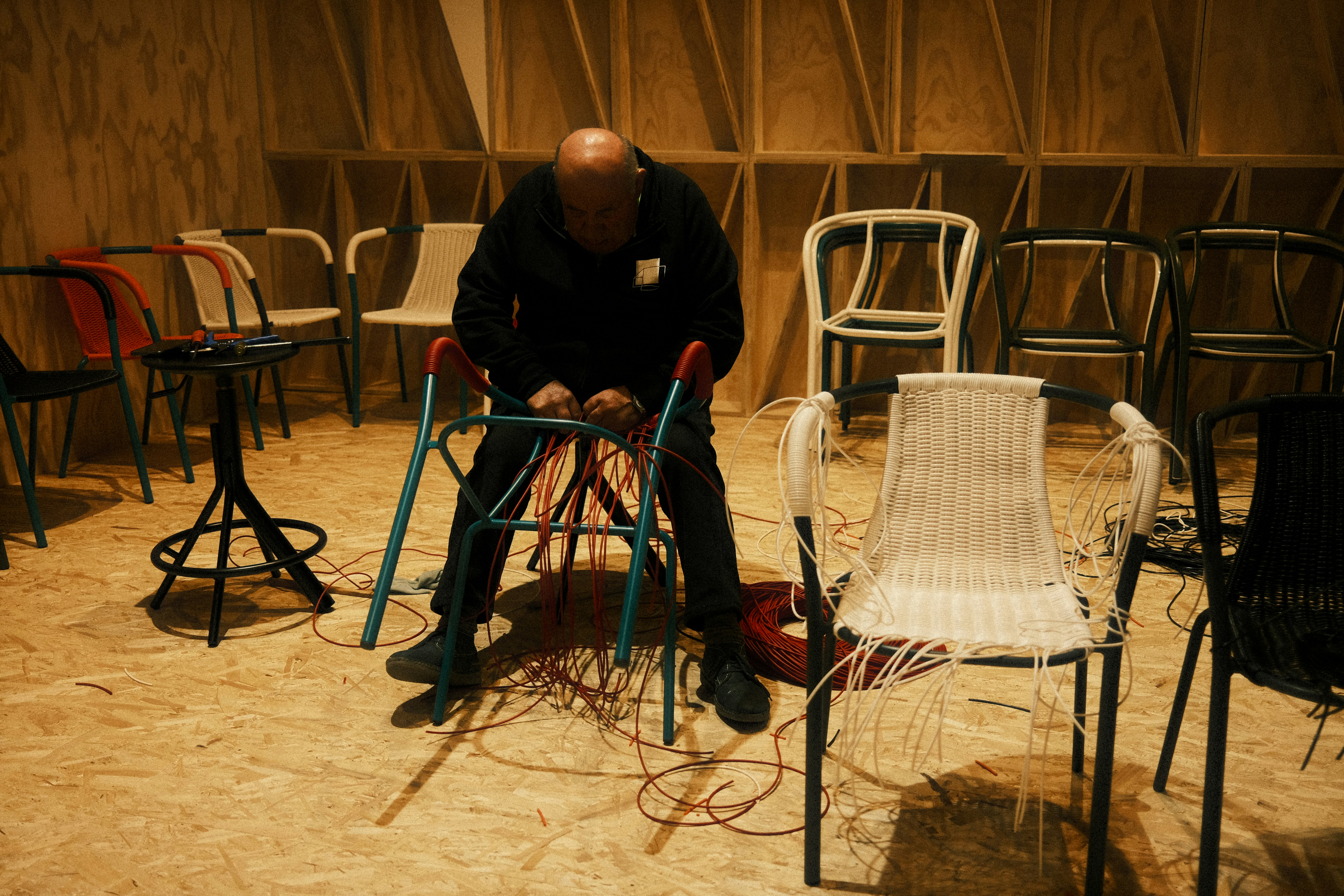 A man sitting on a chair in a room