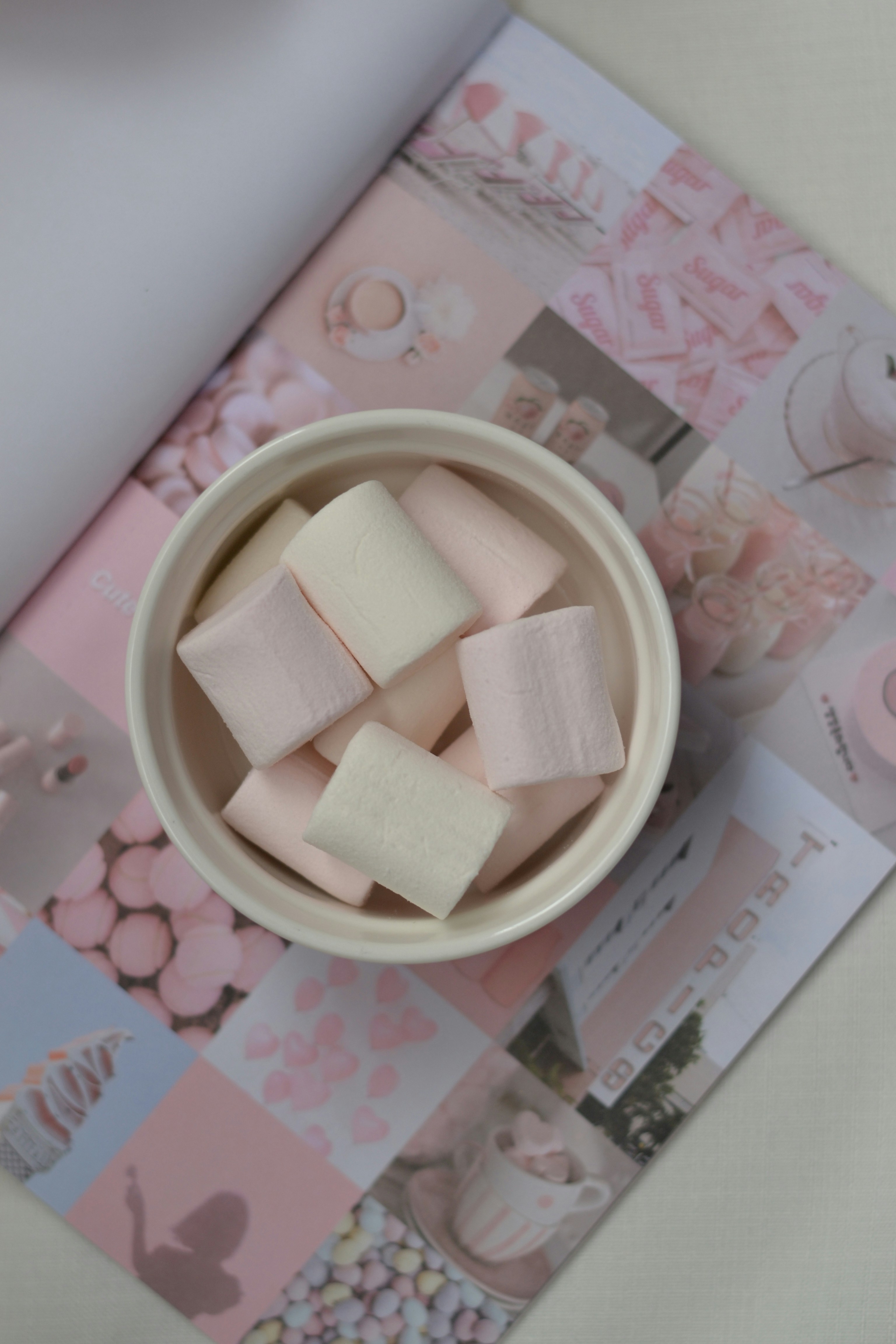 A bowl of marshmallows on a table